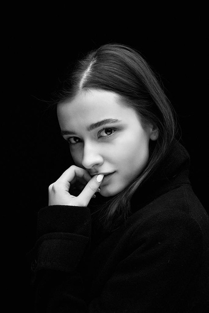 Portrait of gorgeous fashion model against dark studio background  - Photo, image