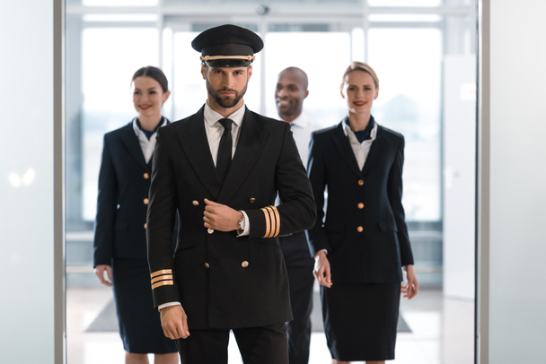 Pilot with stewardesses - Photo, Image