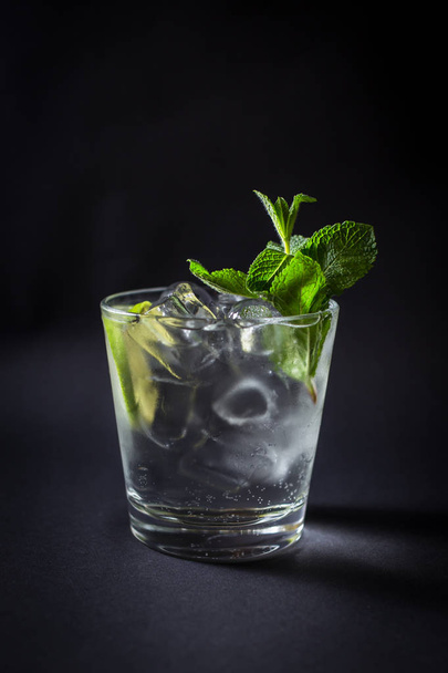 Fresh coctail drink on black background - Foto, imagen