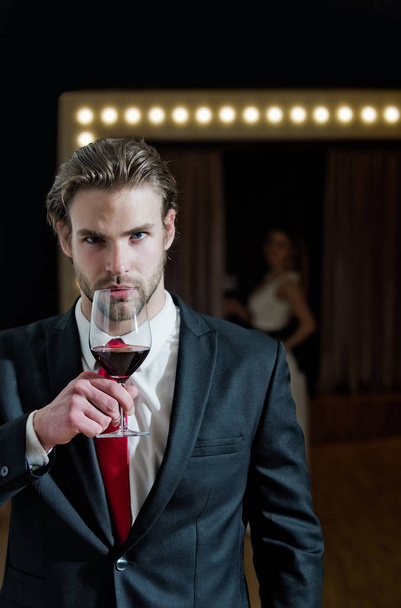 young man or businessman hold wine glass, meeting and relax - Foto, imagen
