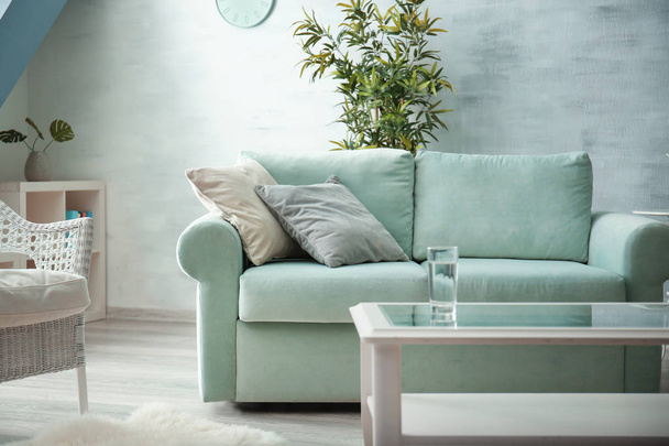 Comfortable sofa with pillows in living room - Φωτογραφία, εικόνα
