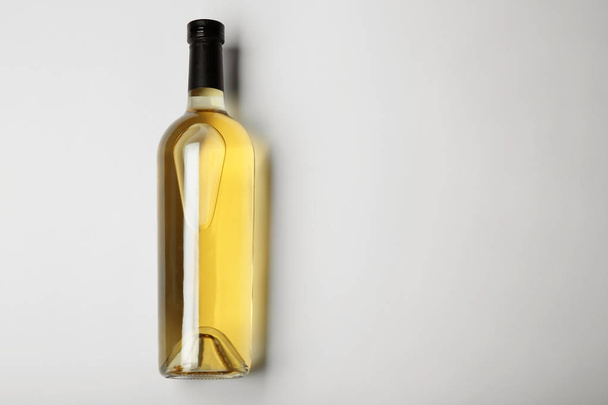 Bottle of wine on light background - Фото, зображення