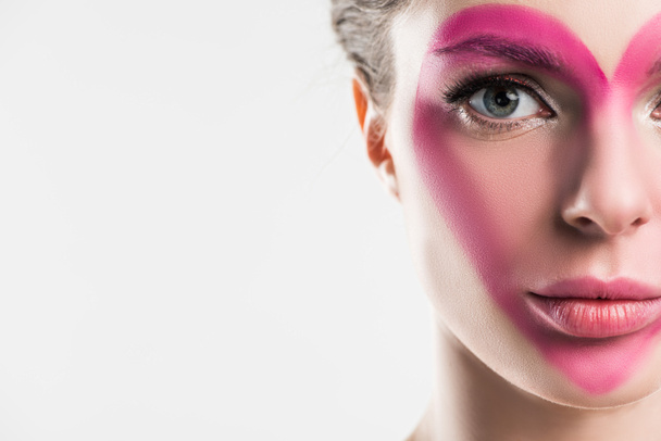 cropped image of girl with painted pink heart on face isolated on white, valentines day concept - 写真・画像