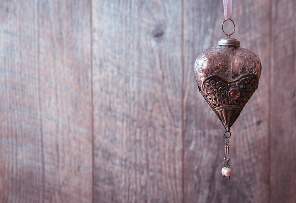 Old silver hearts on wooden desk, vintage holiday background, valentines day - 写真・画像