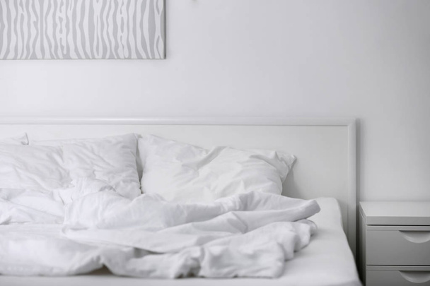 Comfortable bed with soft pillows, closeup - Fotó, kép