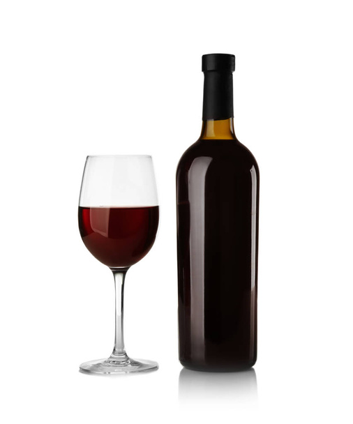 Bottle and glass with red wine on light background - Foto, Imagem