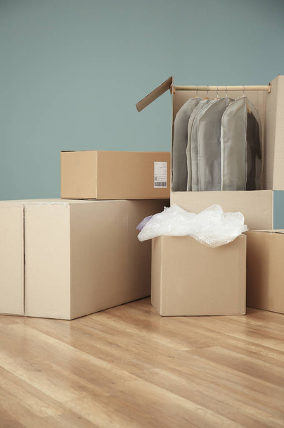 Wardrobe boxes with clothes indoors - Φωτογραφία, εικόνα