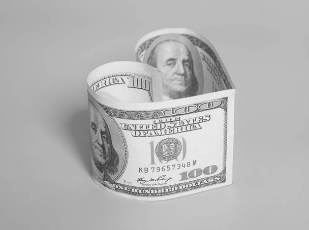 Hundred dollar bill in heart shape - Foto, Imagen