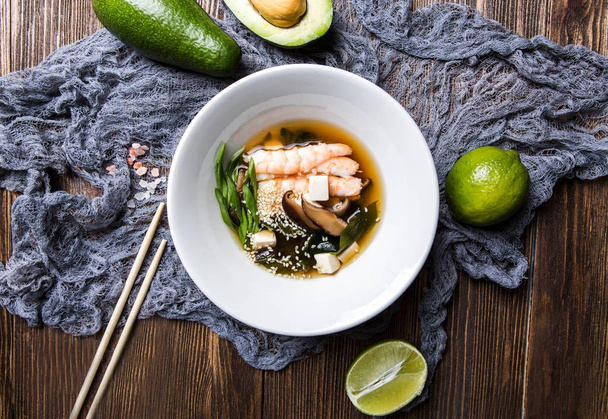 Japanese miso soup with seafood on a dark wooden background top  - Foto, Imagen