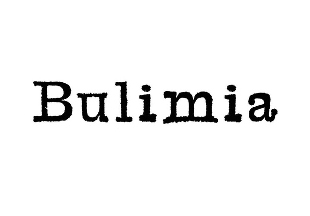 Sana Bulimia kirjoituskoneen valkoisella taustalla
 - Valokuva, kuva