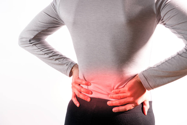 as mulheres sofrem de lesão nas costas / dolorosa após o trabalho
 - Foto, Imagem