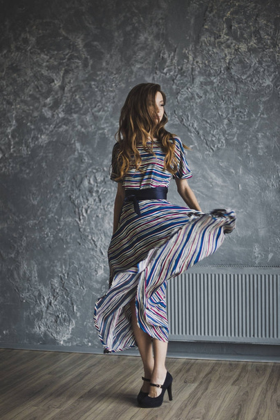 Portrait of a girl in a long striped dress 6978. - Fotó, kép