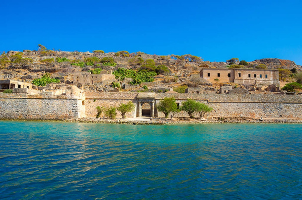 View of the island of Spinalonga with calm sea. Here were isolated lepers, humans with the Hansen's desease, gulf of Elounda, Crete, Greece.  - Photo, Image