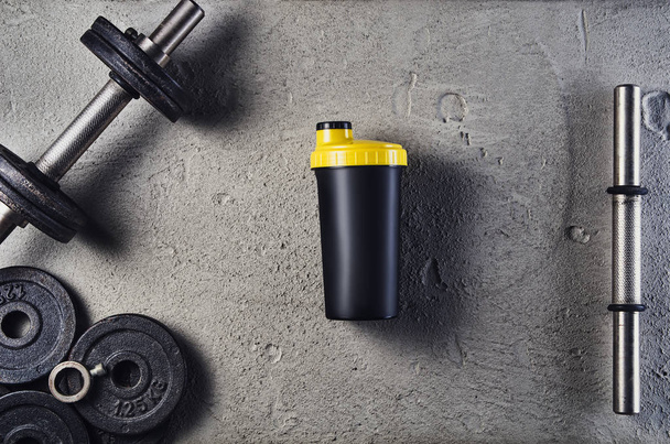 Fitness or bodybuilding background. Dumbbells on gym floor, top view - Valokuva, kuva