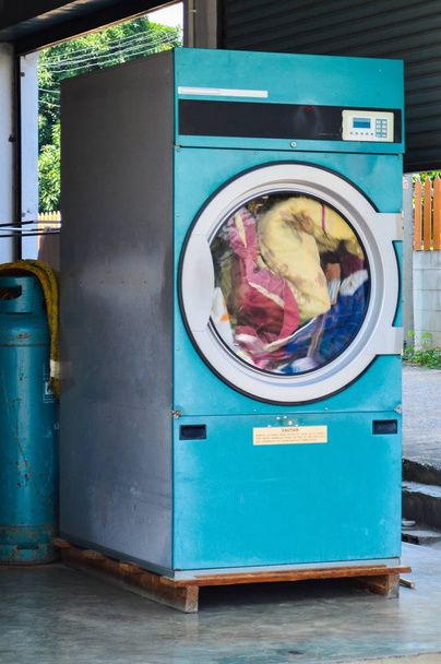 Industrial washing machines in a public laundromat. - Fotó, kép