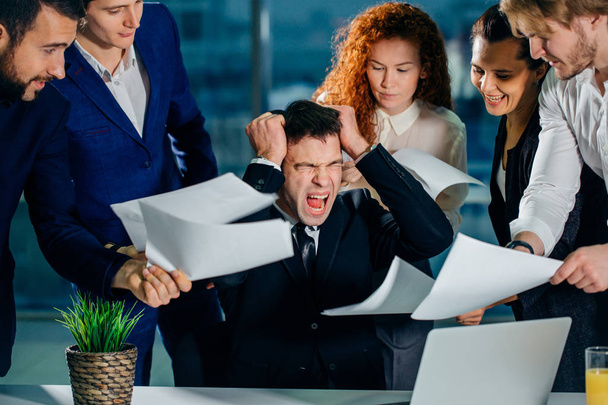 stressed Businessman in office scream, upset with employees ask for attention - Foto, imagen