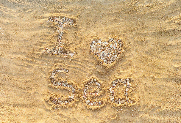 I love sea. Letters and heart made from small stones and seashel - Fotoğraf, Görsel