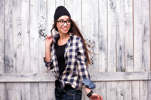 Hipster girl in glasses and black beanie - Фото, изображение