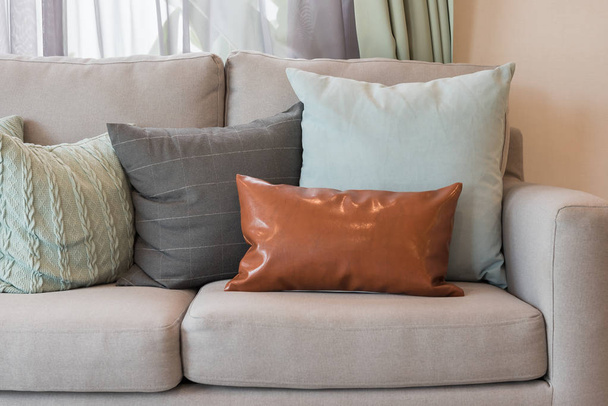 set of pillows on modern cozy grey sofa in modern living room style, interior design concept - Foto, Bild