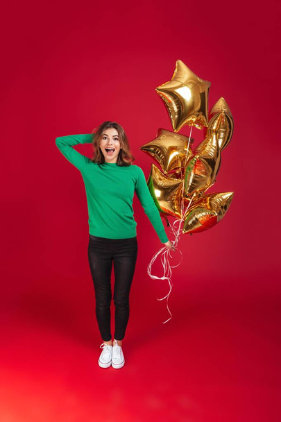 Cheerful young pretty woman holding balloons. - Photo, Image