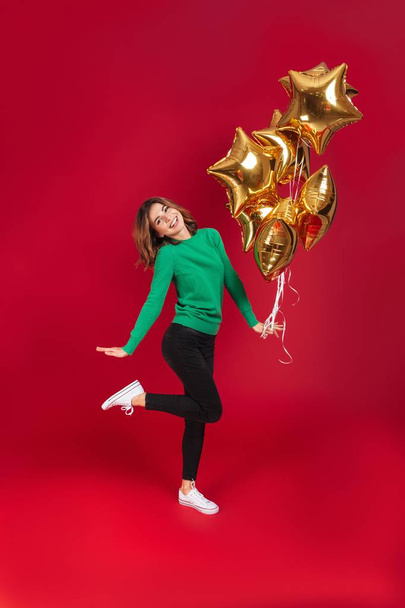 Happy young pretty woman holding balloons. - Zdjęcie, obraz