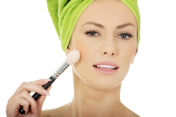Beauty woman with makeup brush. - Fotó, kép