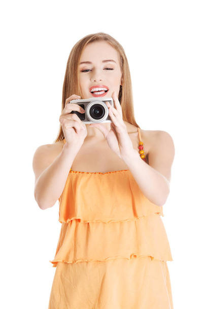 Beautiful caucasian summer woman taking photo. - Photo, image