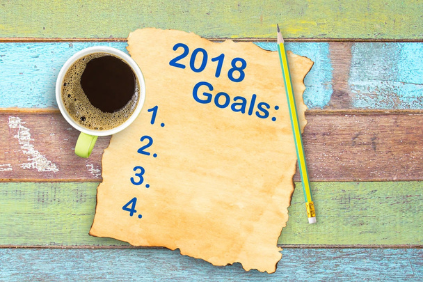 Top view 2018 year goals list on old paper and coffee cup,pencil - Photo, Image
