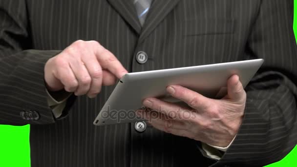 Man in suit scrolling tablet, close up. - Кадри, відео