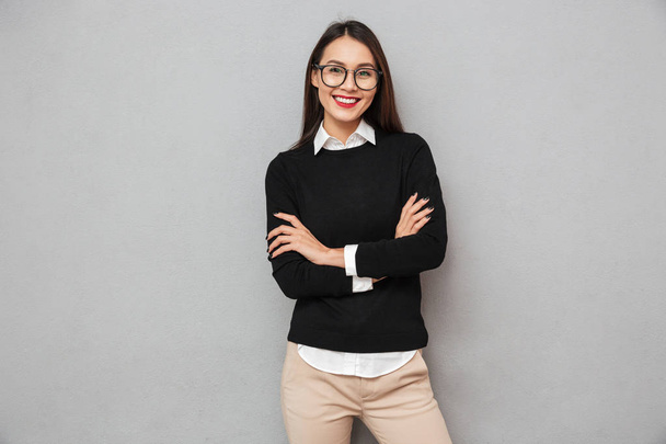 Cheerful asian woman in business clothes and eyeglasses - Fotoğraf, Görsel