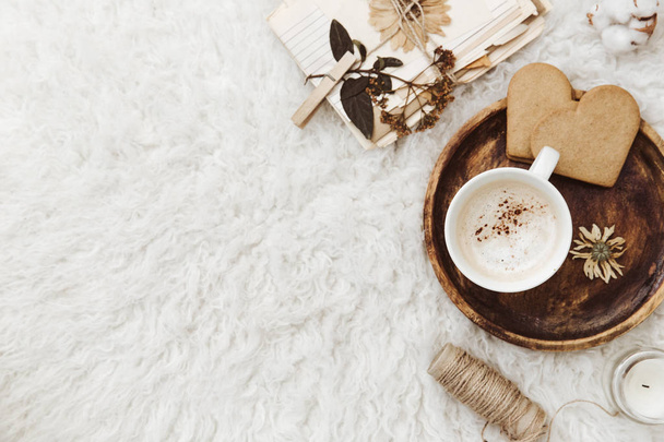 Cozy winter flat lay background, cup of coffee, old vintage paper on white background. Still life trendy composition for bloggers - Fotografie, Obrázek