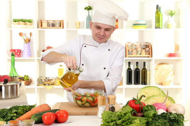 Chef cooking in kitchen - Fotó, kép