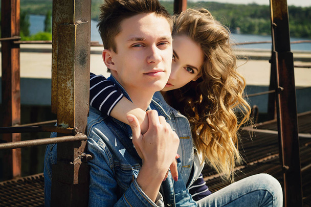 Young beautiful fashion couple wearing jeans clothes in daylight - Photo, Image
