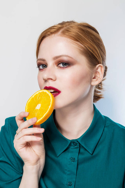 young beautiful woman with citrus orange fruit having. eating orange - Foto, Imagem