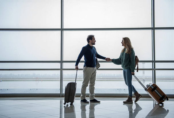 Joyful man and woman going abroad - Fotó, kép