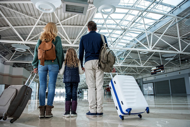 Family standing at the airport hall - Photo, Image
