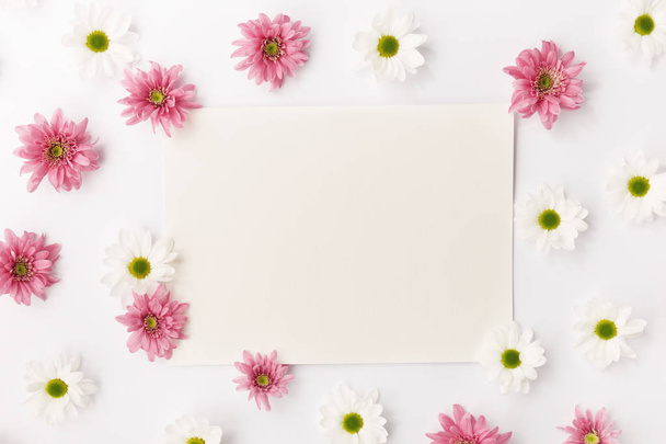 Blank paper in flowers - Valokuva, kuva