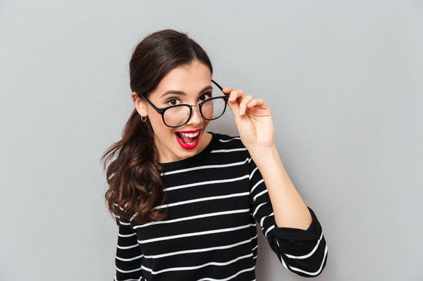 Close up portrait of a cheerful woman in eyeglasses - 写真・画像