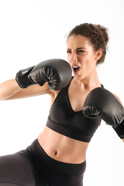 Vertical image of cool screaming curly brunette fitness woman - Foto, Imagem