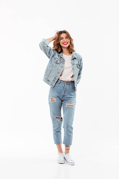 Full length image of Cheerful woman in denim clothes - Фото, изображение