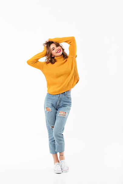 Full length image of Happy woman in sweater posing - Фото, изображение