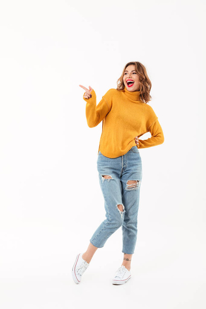 Full length image of Cheerful woman in sweater posing - Fotografie, Obrázek