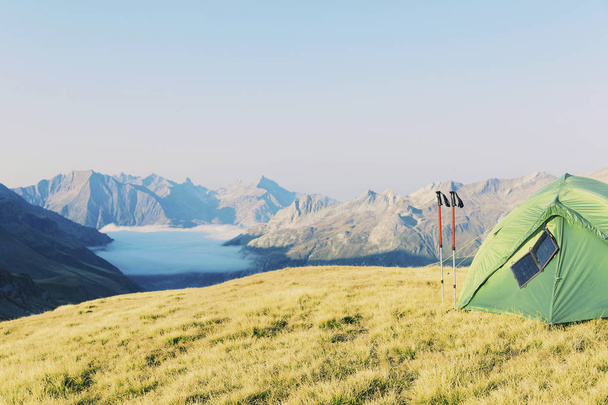 Tent standing on a mountain top. - Foto, imagen