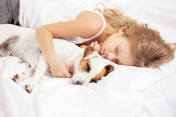 Child sleeping with dog - Fotografie, Obrázek