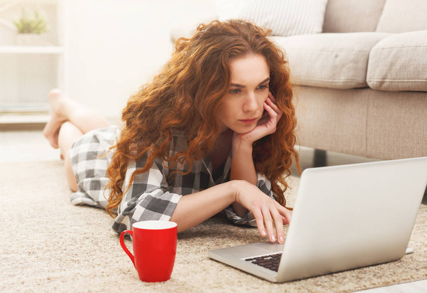 Thoughtful student girl using laptop - Photo, image