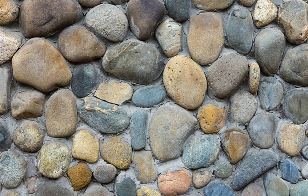 fali kő bézs-szürke kerek ragasztott minta közeli grunge háttér - Fotó, kép