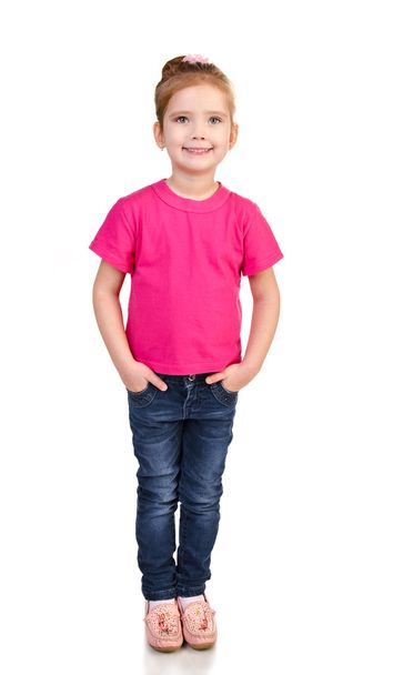 Cute little girl in jeans and t-shirt isolated - Foto, imagen