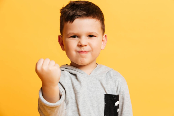 Angry little boy child gesturing with hand. - Фото, зображення