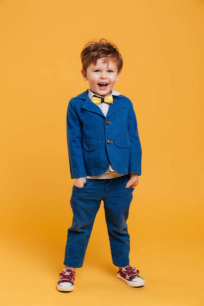 Cheerful excited little boy child standing isolated - Valokuva, kuva