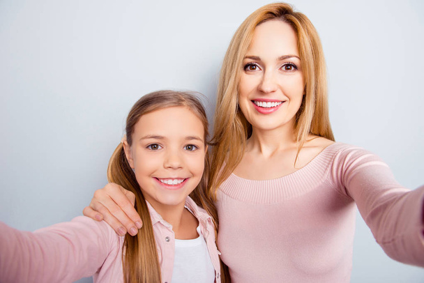 Smiling, nice, sweet, cute mother and daughter with beaming smil - Foto, immagini